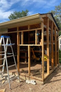 Repair and replace rotted siding and trim on outdoor shed